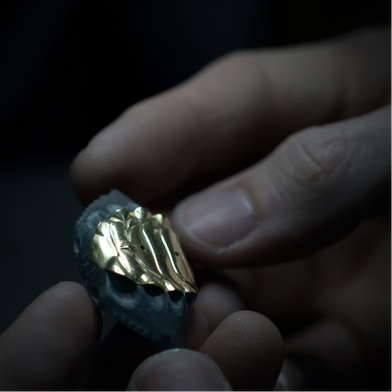 Jeweler carving fine details into the jadeite crab shell
