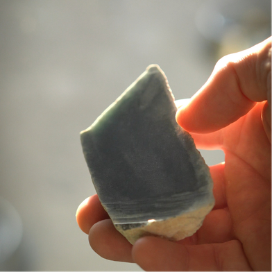 Raw Guatemalan jadeite stone before carving into the Blue Crab Pendant